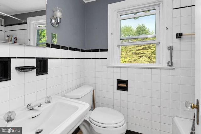 10 Pershing Ave, Ewing, NJ 08618 - full bathroom featuring tile walls, toilet, a sink, a shower, and a tub to relax in