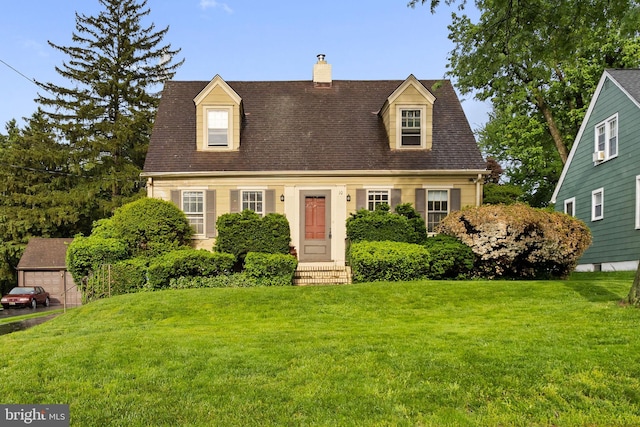 10 Pershing Ave, Ewing, NJ 08618 - new england style home featuring a front lawn, a chimney, and a shingled roof