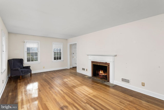 10 Pershing Ave, Ewing, NJ 08618 - unfurnished living room with wood finished floors, a fireplace, and baseboards