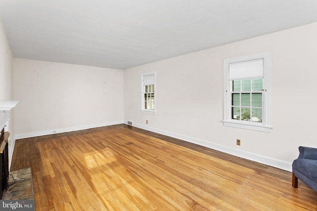 10 Pershing Ave, Ewing, NJ 08618 - unfurnished living room with wood finished floors, plenty of natural light, and baseboards