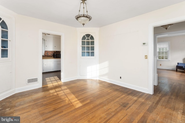 10 Pershing Ave, Ewing, NJ 08618 - unfurnished dining area featuring wood finished floors and baseboards