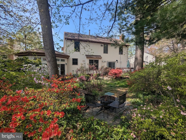 9300 Olivia Pl, Burke, VA 22015 - back of house with a chimney and a patio area