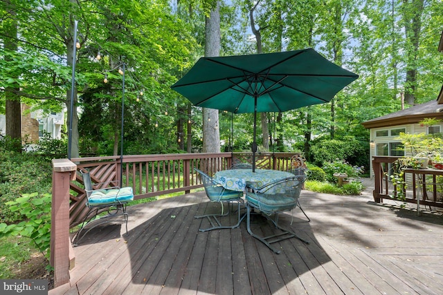 9300 Olivia Pl, Burke, VA 22015 - wooden terrace featuring outdoor dining space and view of wooded area