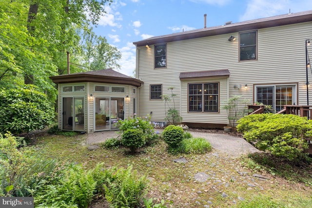 9300 Olivia Pl, Burke, VA 22015 - rear view of house with a sunroom