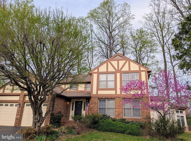 9300 Olivia Pl, Burke, VA 22015 - tudor house featuring brick siding, stucco siding, and asphalt driveway