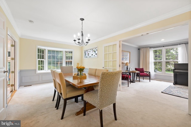 9300 Olivia Pl, Burke, VA 22015 - dining room featuring light carpet, a chandelier, ornamental molding, and a wainscoted wall