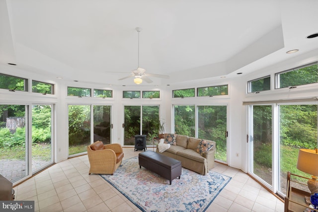 9300 Olivia Pl, Burke, VA 22015 - sunroom featuring tile patterned floors, a raised ceiling, recessed lighting, and a wood stove