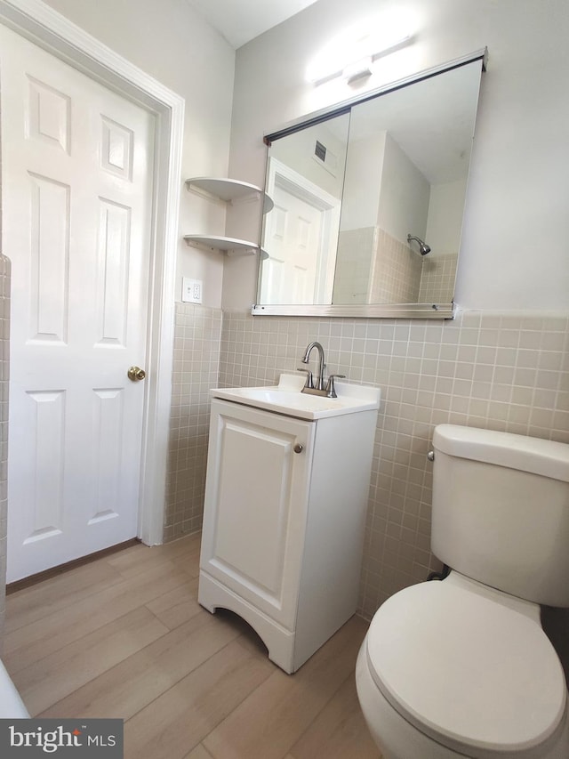 100 Park Blvd Unit 14A, Cherry Hill, NJ 08034 - bathroom with tile walls, wood finished floors, vanity, toilet, and wainscoting