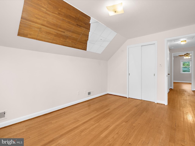 6748 Glenkirk Rd, Baltimore, MD 21239 - bonus room featuring wood finished floors, lofted ceiling, and baseboards