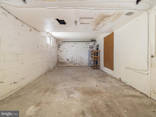 6748 Glenkirk Rd, Baltimore, MD 21239 - below grade area featuring water heater and concrete block wall