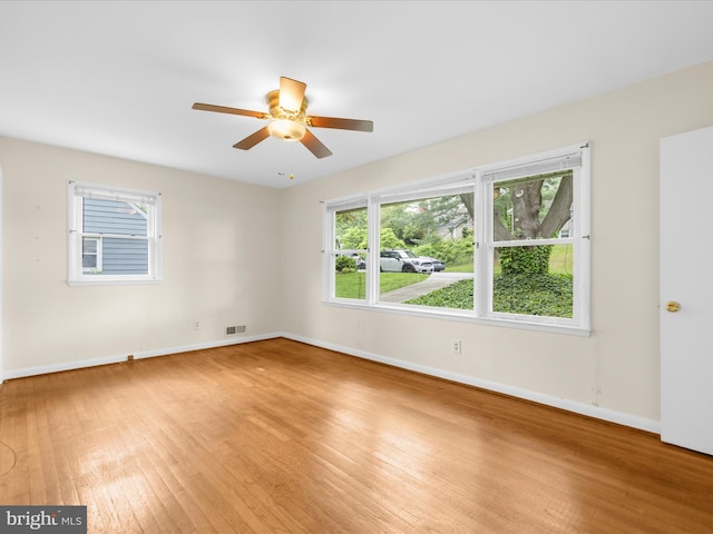 6748 Glenkirk Rd, Baltimore, MD 21239 - unfurnished room with light wood-type flooring, ceiling fan, and healthy amount of natural light