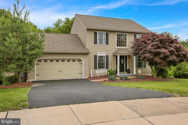 7 Kantner Ln N, Reading, PA 19607 - view of front of house with a garage, driveway, a front lawn, and a shingled roof