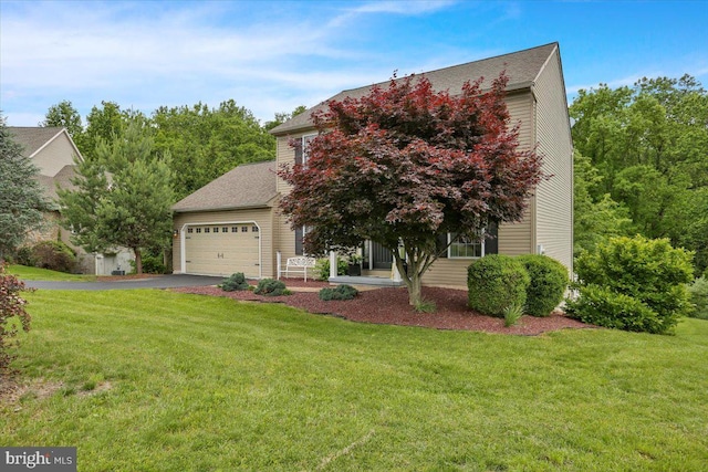 7 Kantner Ln N, Reading, PA 19607 - view of property hidden behind natural elements with asphalt driveway, a front yard, a garage, and a shingled roof