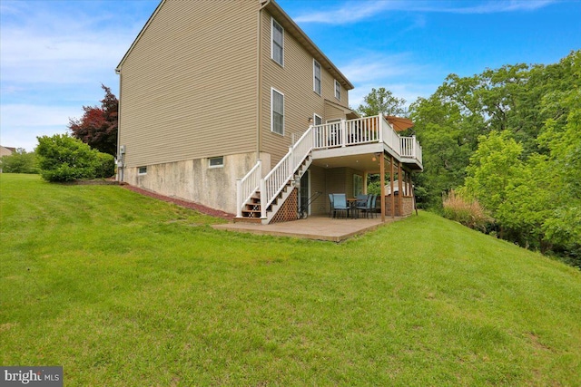 7 Kantner Ln N, Reading, PA 19607 - back of property with a lawn, a deck, a patio area, and stairs