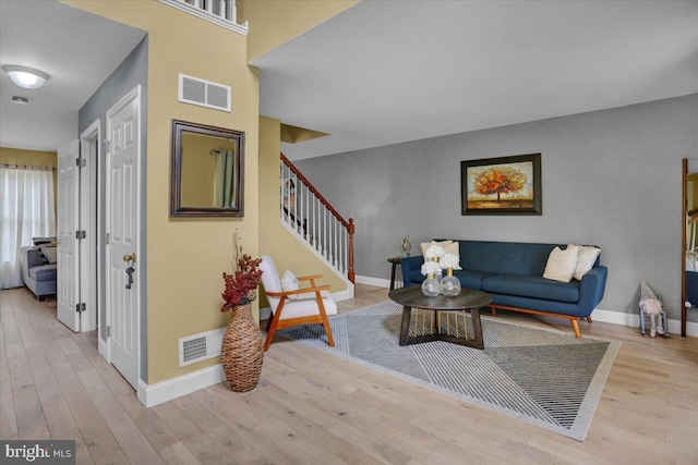 7 Kantner Ln N, Reading, PA 19607 - living room featuring baseboards, wood finished floors, and stairway