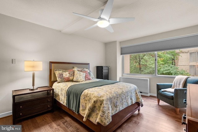 4515 Willard Ave Unit 610S, Chevy Chase, MD 20815 - bedroom featuring wood-type flooring, radiator heating unit, baseboards, and ceiling fan