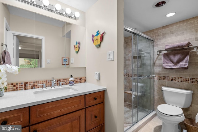4515 Willard Ave Unit 610S, Chevy Chase, MD 20815 - bathroom with vanity, toilet, a stall shower, and decorative backsplash