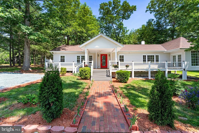 347 Clarks Tract Tract, Keswick, VA 22947 - view of front facade with roof with shingles, a front yard, and covered porch