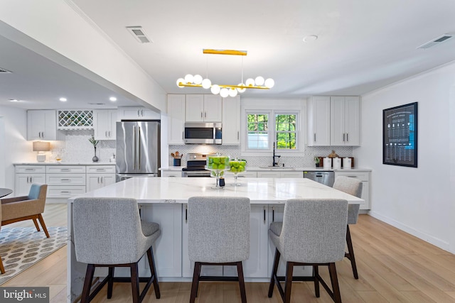 347 Clarks Tract Tract, Keswick, VA 22947 - kitchen featuring stainless steel appliances, decorative backsplash, white cabinets, and recessed lighting
