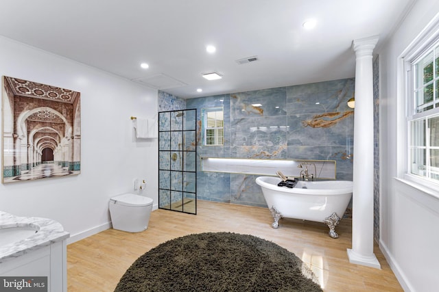347 Clarks Tract Tract, Keswick, VA 22947 - bathroom featuring a freestanding bath, tile walls, vanity, wood finished floors, and ornate columns