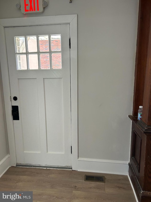 825 Jersey Ave, Gloucester City, NJ 08030 - doorway featuring wood finished floors and baseboards