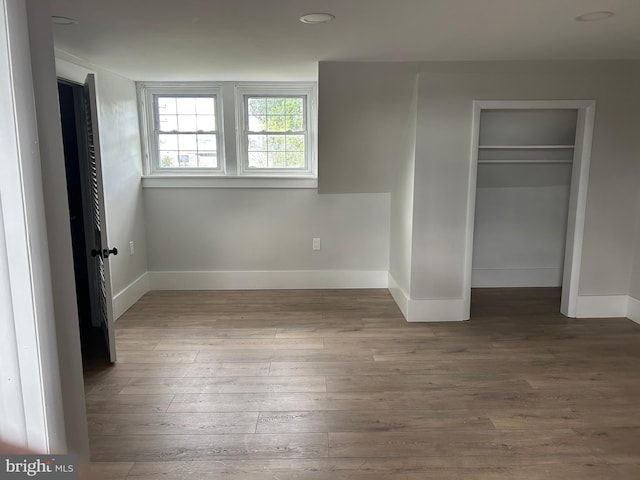825 Jersey Ave, Gloucester City, NJ 08030 - unfurnished bedroom featuring baseboards, wood finished floors, and a closet