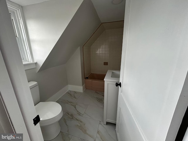 825 Jersey Ave, Gloucester City, NJ 08030 - bathroom featuring marble finish flooring, toilet, a tub to relax in, and baseboards