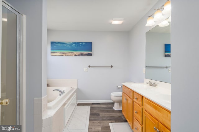 51 Phoebe Farms Ln, New Castle, DE 19720 - bathroom featuring double vanity, a bath, wood finished floors, toilet, and baseboards