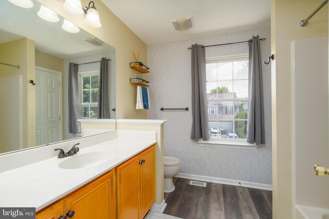 51 Phoebe Farms Ln, New Castle, DE 19720 - bathroom with baseboards, wood finished floors, toilet, vanity, and a shower