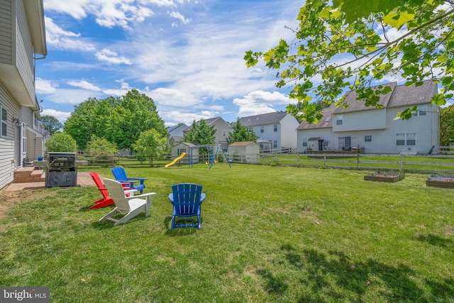51 Phoebe Farms Ln, New Castle, DE 19720 - view of yard featuring a playground, a garden, and a residential view