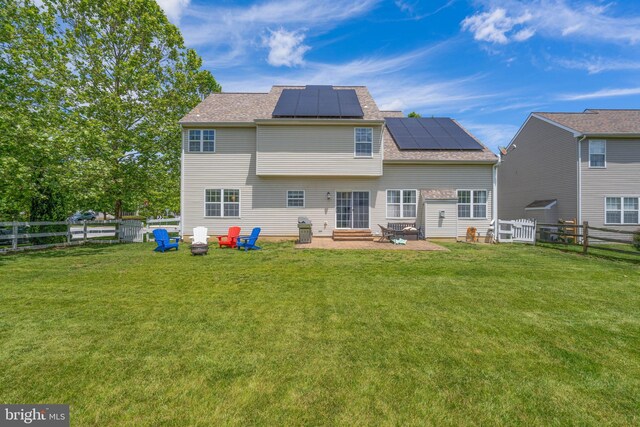 51 Phoebe Farms Ln, New Castle, DE 19720 - rear view of property featuring solar panels, entry steps, and a patio area