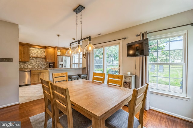 2 E Park Rd, Newtown, PA 18940 - dining space featuring healthy amount of natural light, baseboards, and wood finished floors