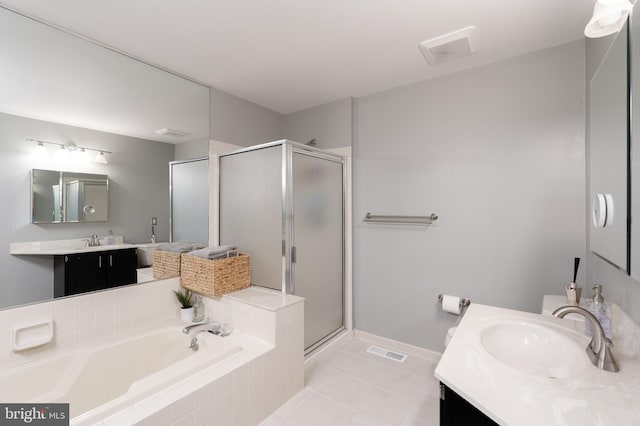 2 E Park Rd, Newtown, PA 18940 - bathroom featuring a shower stall, a garden tub, vanity, and tile patterned floors