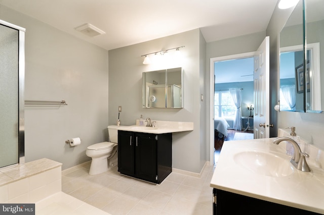 2 E Park Rd, Newtown, PA 18940 - ensuite bathroom featuring vanity, toilet, a shower with door, and tile patterned floors