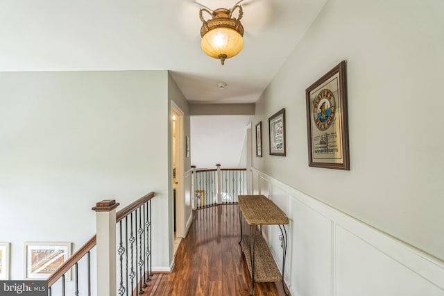 2 E Park Rd, Newtown, PA 18940 - corridor featuring an upstairs landing, dark wood-style flooring, wainscoting, and a decorative wall