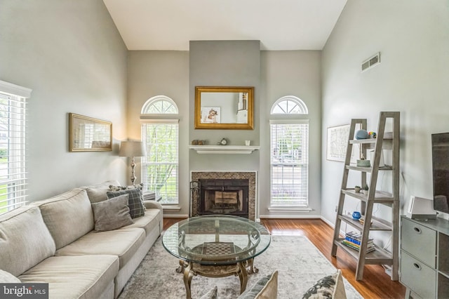 2 E Park Rd, Newtown, PA 18940 - living room featuring a fireplace, wood finished floors, and baseboards