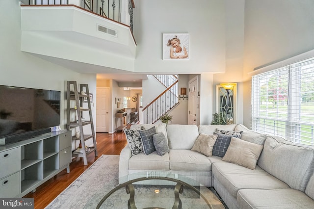 2 E Park Rd, Newtown, PA 18940 - living room featuring a high ceiling, stairway, and dark wood-type flooring
