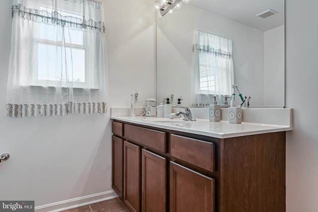 1 Bertram Dr, Glen Burnie, MD 21060 - bathroom featuring plenty of natural light, vanity, and tile patterned flooring
