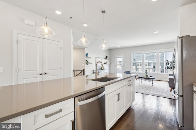 1909 Greenbriar Hall Rd, Dumfries, VA 22026 - kitchen featuring stainless steel appliances, a sink, white cabinets, dark wood-style floors, and open floor plan