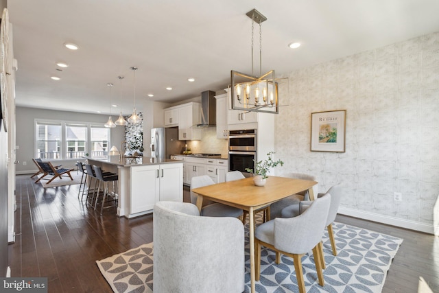1909 Greenbriar Hall Rd, Dumfries, VA 22026 - dining room with a chandelier, dark wood-style floors, baseboards, and recessed lighting