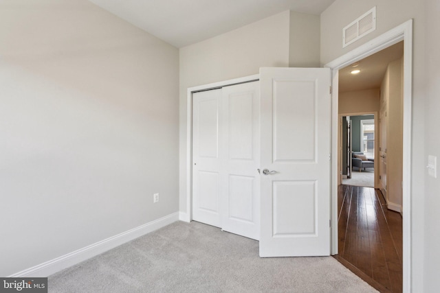 1909 Greenbriar Hall Rd, Dumfries, VA 22026 - unfurnished bedroom featuring baseboards, a closet, and carpet