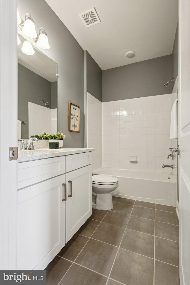1909 Greenbriar Hall Rd, Dumfries, VA 22026 - full bathroom with vanity, tile patterned floors,  shower combination, and toilet