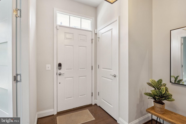 1909 Greenbriar Hall Rd, Dumfries, VA 22026 - foyer entrance with baseboards and dark wood-style floors