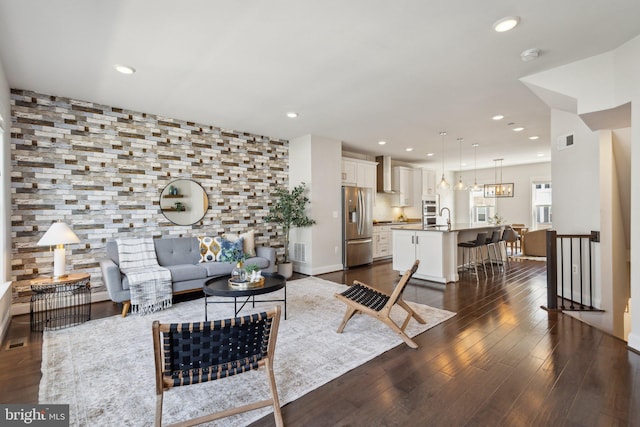 1909 Greenbriar Hall Rd, Dumfries, VA 22026 - living area featuring recessed lighting, dark wood-type flooring, and baseboards