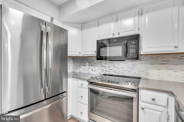 1334 Garden Wall Cir Unit 407, Reston, VA 20194 - kitchen with stainless steel appliances, white cabinets, tasteful backsplash, and light countertops