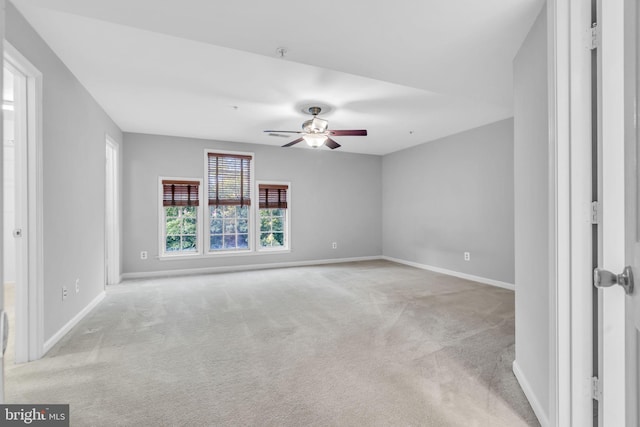 1334 Garden Wall Cir Unit 407, Reston, VA 20194 - spare room featuring light colored carpet, a ceiling fan, and baseboards