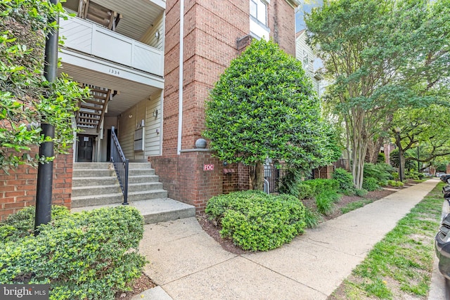 1334 Garden Wall Cir Unit 407, Reston, VA 20194 - view of exterior entry featuring brick siding