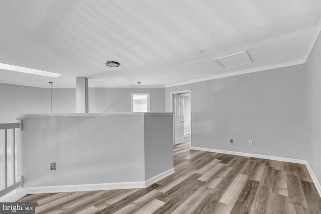 1334 Garden Wall Cir Unit 407, Reston, VA 20194 - unfurnished room with crown molding, wood finished floors, and baseboards