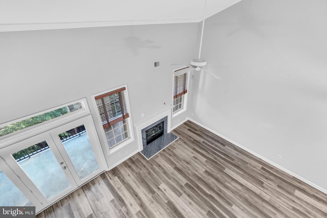 1334 Garden Wall Cir Unit 407, Reston, VA 20194 - unfurnished living room with ornamental molding, a high ceiling, wood finished floors, a ceiling fan, and baseboards