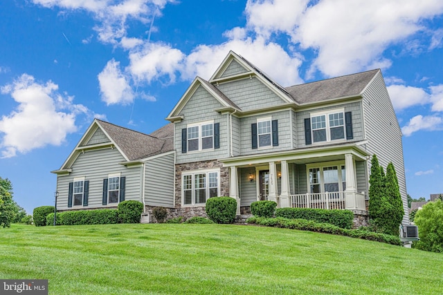 7425 Signal Hill Rd, Manassas, VA 20111 - craftsman-style house with stone siding, covered porch, a front yard, and roof with shingles
